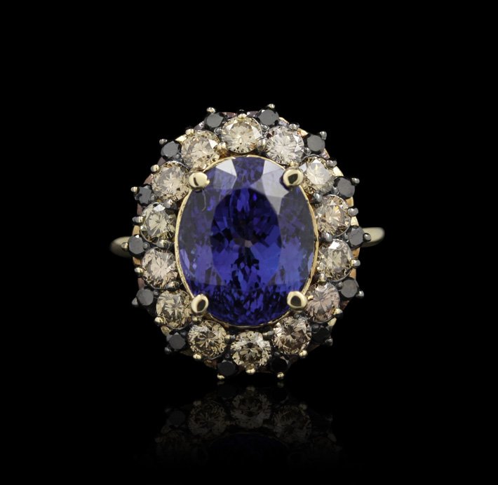 14KT Yellow Gold 7.72ct Tanzanite, Black and White Diam: 14KT Yellow Gold 7.72ct Tanzanite, Black and White Diamond Ring A4140. Excellent Condition! XM7352RP. One electronically tested 14KT yellow gold ladies cast tanzanite, black & white diamond ring with 