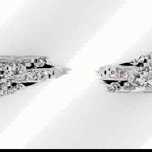 Art Deco Platinum 0.50 ctw Old European Diamond Engagement Ring: A platinum art deco period ring featuring a 0.30ct old European cut diamond (J - VS2) prong set at its center among 0.20ctw of bezel and pave set round single cut diamonds (G - VS1/VS2). The ring is s