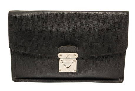 Louis Vuitton Black Taiga Leather Belaia Clutch: One Louis Vuitton Black Taiga Leather Belaia Clutch. Item is sold AS-IS. All available information is listed in the description and shown in the photo. Louis Vuitton Black Taiga Leather Belaia Clutch