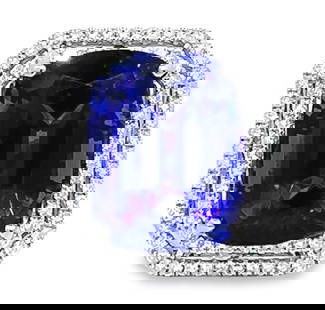 25.20 ctw Tanzanite and 1.66 ctw Diamond Ring - 14KT White Gold: One electronically tested 14KT white gold lady's cast fashion emerald basket double halo ring with a cathedral shank with a bright polish finish. The featured lady's ring has a shank measuring 3.90 mi