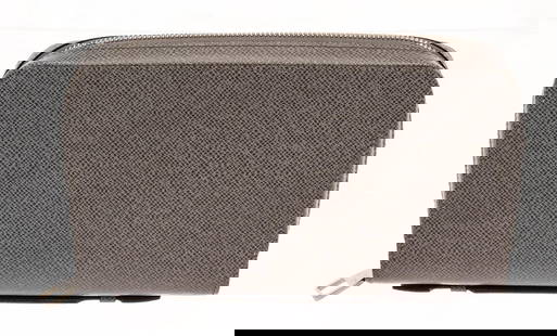 Louis Vuitton Grey Taiga Leather XL Zippy Wallet: Louis Vuitton Grey Taiga Leather XL Zippy Wallet. All available information is listed in the description and shown in the photos. Louis Vuitton Grey Taiga Leather XL Zippy Wallet with gold-tone hardwa