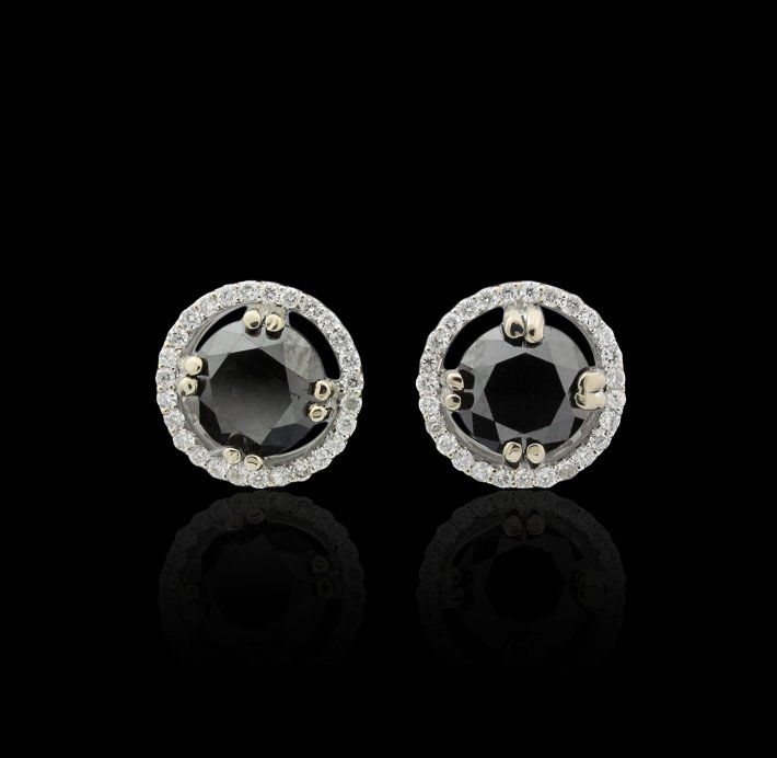 14KT White Gold 3.3ct Black and White Diamond Stud Earr: 14KT White Gold 3.3ct Black and White Diamond Stud Earrings J44. New Condition! WZ547YE. One pair electronically tested 14KT white gold cast and assembled black and white diamond earrings with standar