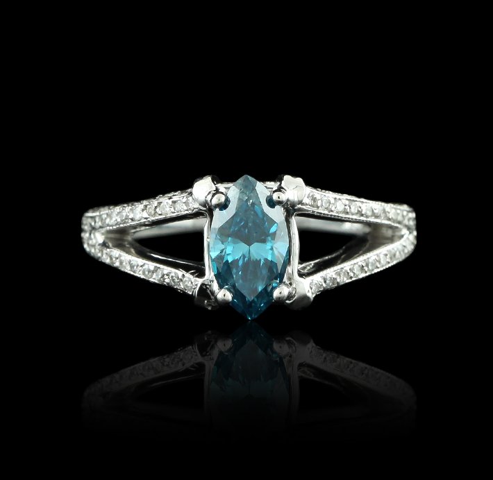 18KT White Gold 0.91ct Blue Diamond & White Diamond Rin: 18KT White Gold 0.91ct Blue Diamond & White Diamond Ring GB1429. Good condition! MR7821VG. One electronically tested 18KT white gold ladies cast & assembled diamond unity ring. Condition is good. The 