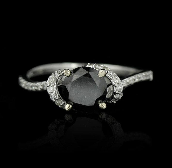 18KT White Gold 1.42ct Black & White Diamond Ring RM100: 18KT White Gold 1.42ct Black & White Diamond Ring RM1008. Great Condition! YR963DG. One lady’s polish, stamped and electronically tested solid 18k white gold ring mounted with: 1 Genuine Round Black