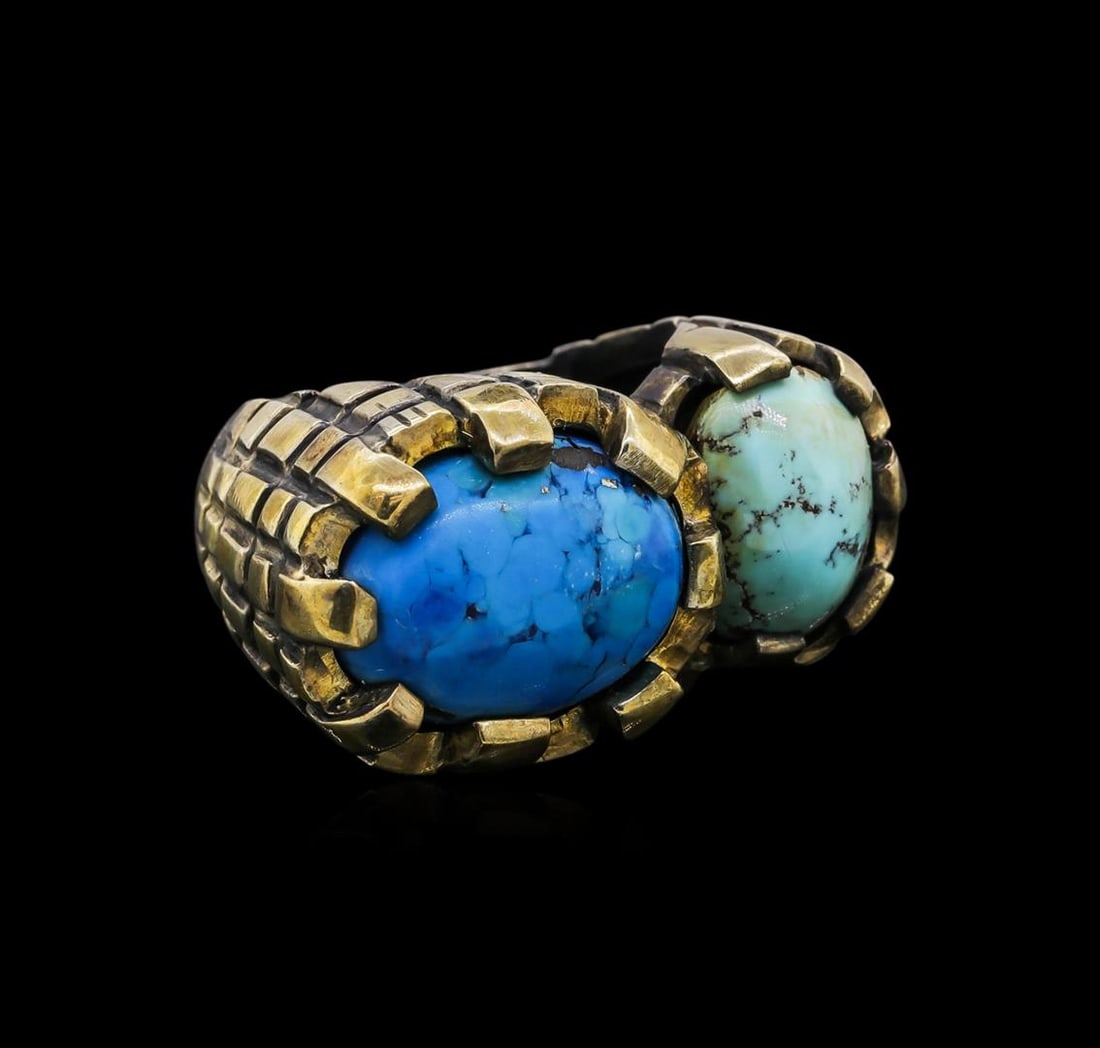 Sterling Silver Ring: One of a kind high fashion sterling silver Ring weighing 19.6 grams. Black Antique texture. Containing: Treated Turquoise. This sterling silver promises a lasting shine.