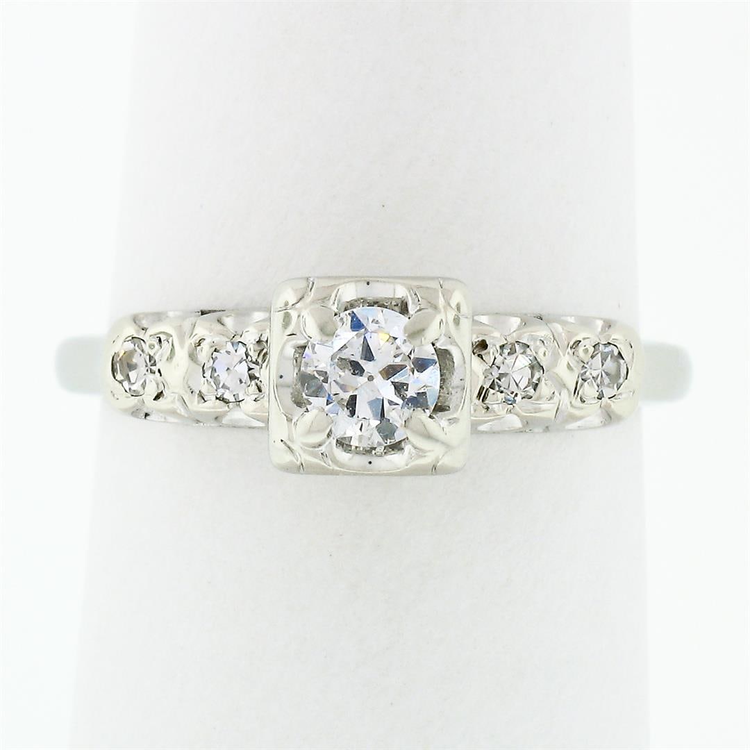 Vintage 14k White Gold 0.37 ctw Round Diamond Solitaire & Accents Engagement Rin: A vintage solid 14k white gold ring with 1 round transitional cut natural diamond (G - VS2; 0.27ct) and 4 round single cut natural diamonds (G/H - VS2; 0.10ctw). The ring is size 6.0, weighs a total o