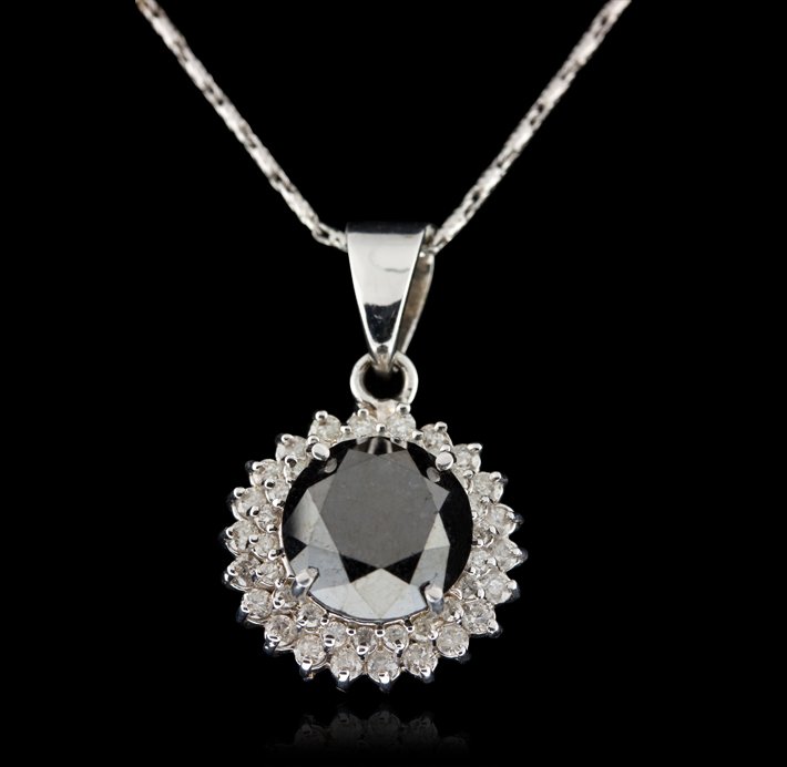 14KT White Gold 6.73ct Black and White Diamond Pendant : 14KT White Gold 6.73ct Black and White Diamond Pendant with Chain RM946. Great Condition! WG9031NM. One lady's polished, stamped and electronically tested solid 14K white gold pendant mounted with: 1 