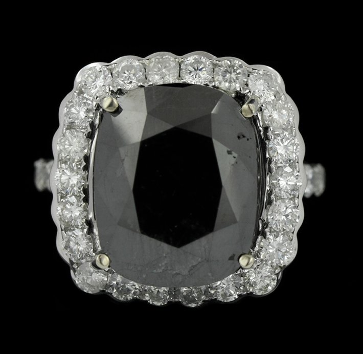 14KT White Gold 16.70ct Black and White Diamond Ring RM: 14KT White Gold 16.70ct Black and White Diamond Ring RM990. Great Condition! FN9093DE. One electronically tested 14KT white gold ladies cast black and white diamond ring with bright polish finish. Con
