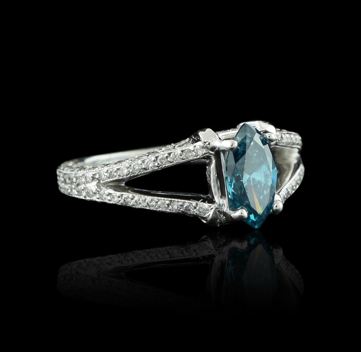 18KT White Gold 0.91ct Blue Diamond & White Diamond Rin: 18KT White Gold 0.91ct Blue Diamond & White Diamond Ring GB1429. Good condition! MR7821VG. One electronically tested 18KT white gold ladies cast & assembled diamond unity ring. Condition is good. The 
