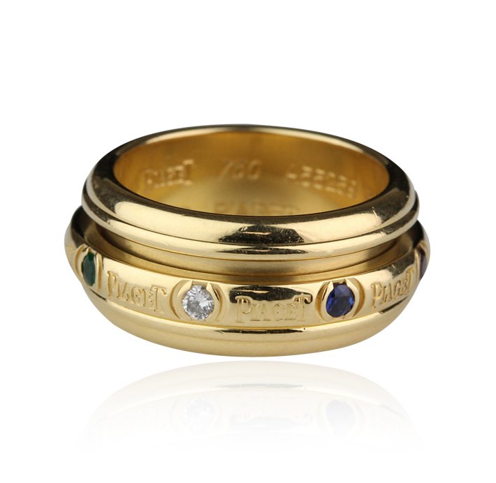 Piaget 18KT Yellow Gold Multi-Colored Gemstone Tension : Piaget 18KT Yellow Gold Multi-Colored Gemstone Tension Ring GB784. Good Condition! IG9011KX. One Piaget 18KT yellow gold multi-colored gemstone tension ring. The ring features: 18KT yellow gold, uniqu
