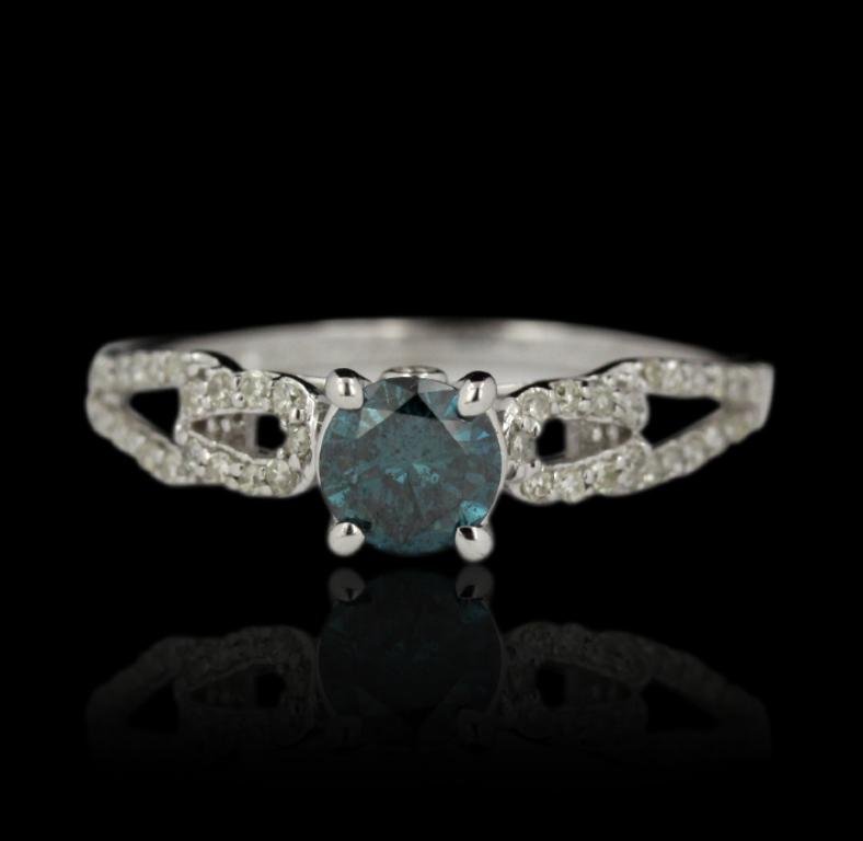 14KT White Gold 0.77ct Blue Diamond and White Diamond: 14KT White Gold 0.77ct Blue Diamond and White Diamond Ring FJM2443. Excellent Condition! TD804UG. One ring featuring: 1.65gm of 14KT white gold, (1) blue diamond with a total weight of 0.77ct and (42)