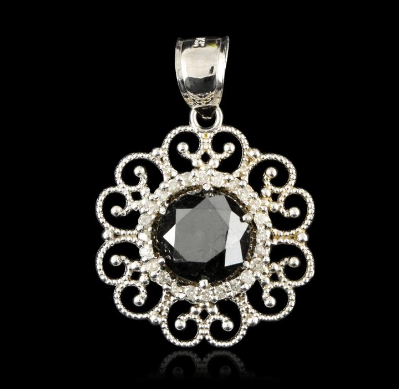 14KT White Gold 3.90ct Black & White Diamond Pendant: 14KT White Gold 3.90ct Black & White Diamond Pendant FRD158. Great Condition! XN4001QT. One electronicaly tested 14KT white gold ladies cast & assembled black and white diamond pendant. Condition is n