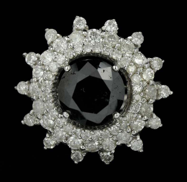 14KT White Gold 4.18ct Black and White Diamond Ring: 14KT White Gold 4.18ct Black and White Diamond Ring RM992. Great Condition! TZ7031HM. One lady's polished, stamped and electronically tested solid 14k white gold ring mounted with: Genuine Round Black
