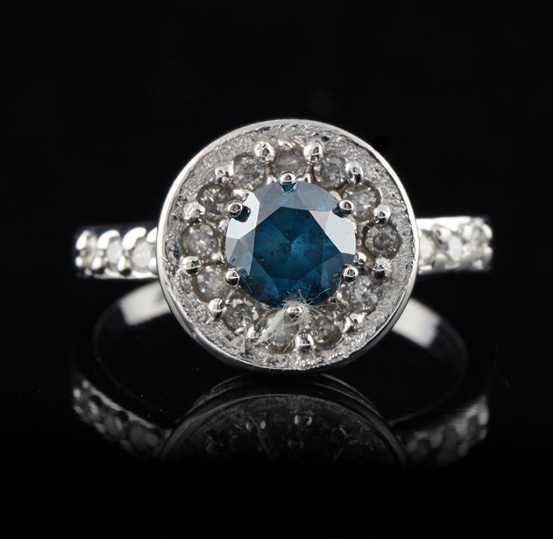 14KT White Gold 0.90ct Blue and White Diamond Ring: 14KT White Gold 0.90ct Blue and White Diamond Ring FRD96. Great Condition! RW509XS. One electronically tested 14KT white gold ladies cast diamond ring with a bright polish finish. Condition is new, go