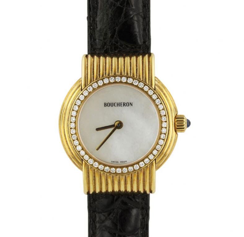 Boucheron 18KT Yellow Gold MOP and Diamond Wristwatch: Boucheron 18KT Yellow Gold MOP and Diamond Wristwatch GB1152. Great Condition! SS5091VM. One ladies Boucheron 18KT yellow gold mother of pearl and diamond wristwatch. The watch features: 18KT yellow g