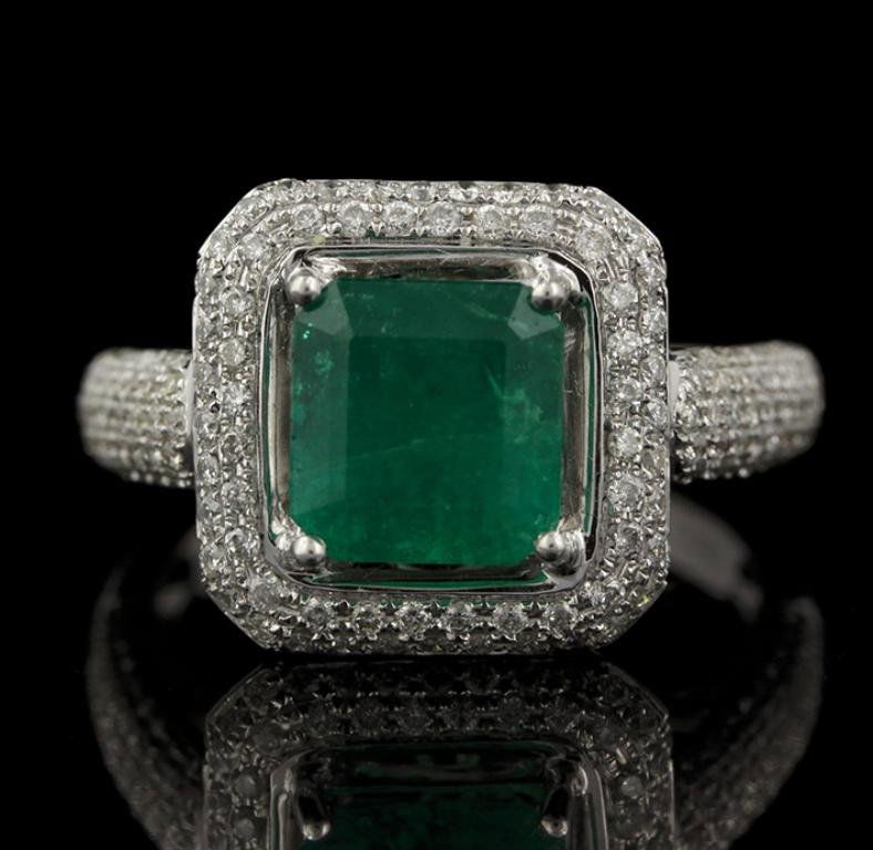 18KT White Gold 2.03ct Emerald and Diamond Ring FJM2261: 18KT White Gold 2.03ct Emerald and Diamond Ring FJM2261. Excellent Condition! WH2001NX. One ring featuring: 5.70gm of 18KT white gold, (1) emerald with a total weight of 2.03cts and (48) round cut dia