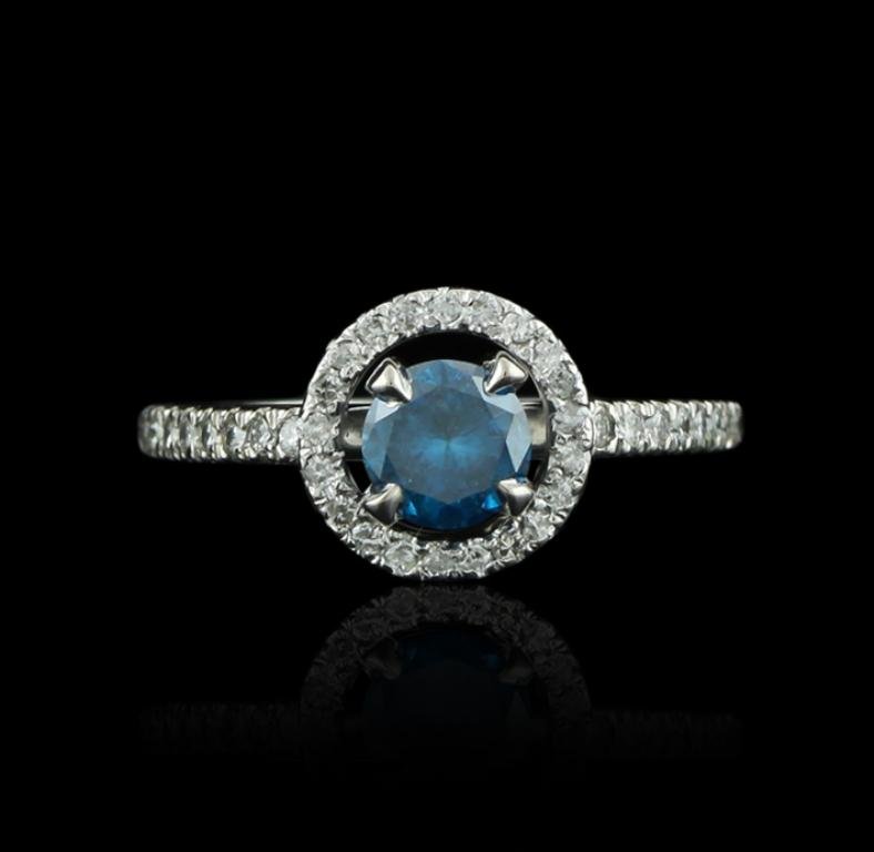 14KT White Gold 0.52ct Blue Diamond and White Diamond: 14KT White Gold 0.52ct Blue Diamond and White Diamond Ring GB1449. Good condition! DJ2011YT. One ring featuring: 3.5 grams of 14KT white gold, (1) blue diamond with a total weight of 0.52ct and diamon