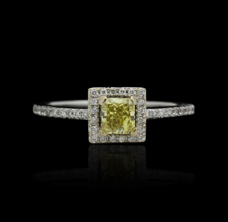 14KT White Gold .65ct Yellow and White Diamond Ring J31: 14KT White Gold .65ct Yellow and White Diamond Ring J31. New Condition! RM758WP. One electronically tested 14KT white gold ladies cast diamond ring. Good workmanship. The featured diamond is set withi