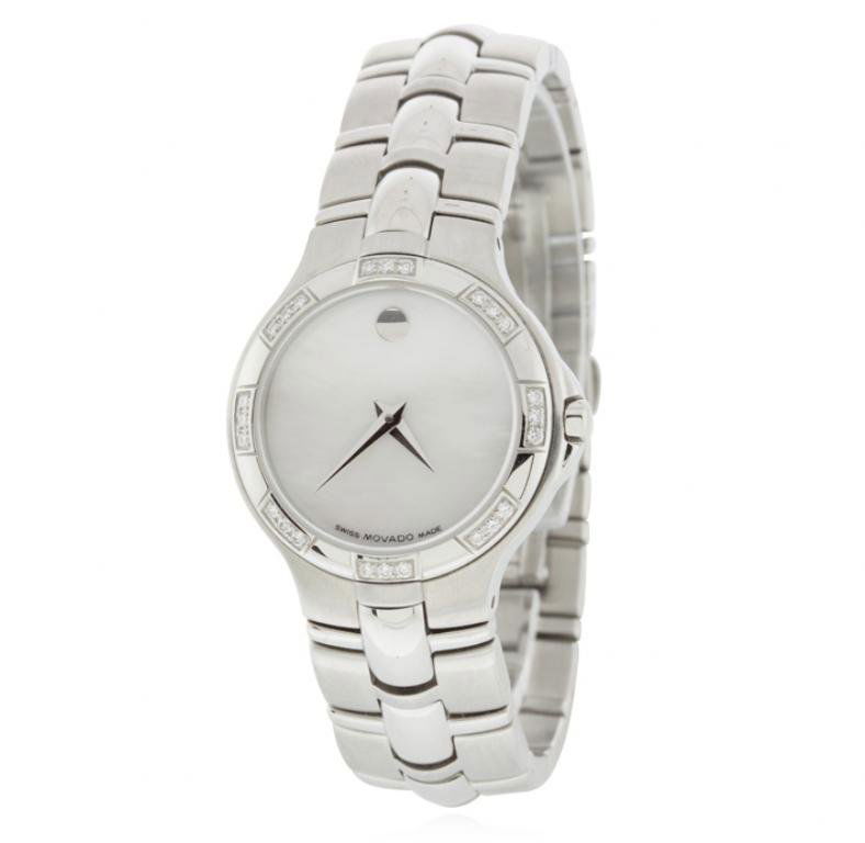 Movado Ladies Diamond Bezel Watch GB1607: Movado Ladies Diamond Bezel Watch GB1607. Good condition! ER357EM. One ladies Movado watch. The watch features a stainless steel case measuring 30mm, stainless steel bracelet and clasp, stainless stee