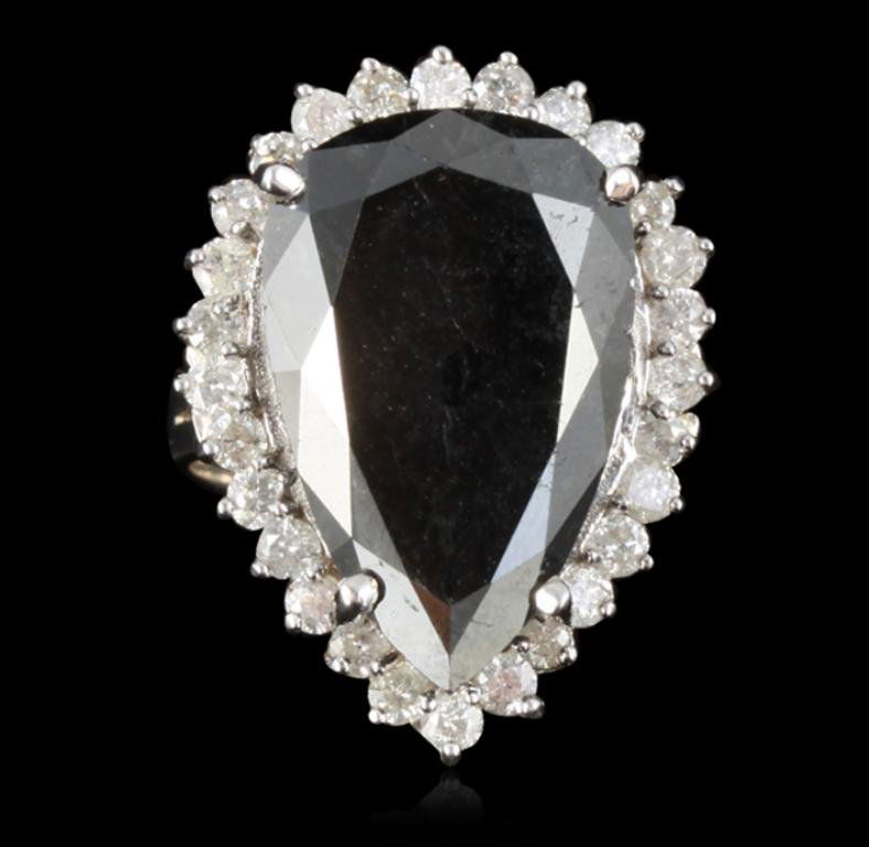 14KT White Gold 16.82ct Black Diamond Ring RM1143: 14KT White Gold 16.82ct Black Diamond Ring RM1143. Great Condition! XC1053SR. One electronically tested 14KT white gold ladies black and white diamond ring with a brilliant polish finish. Condition is