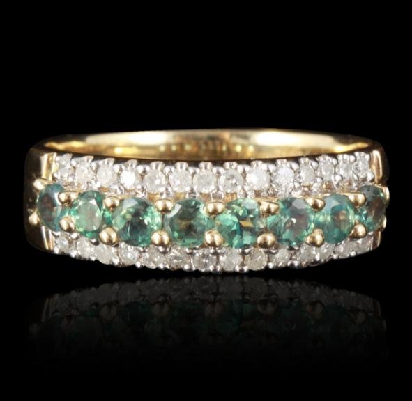 14KT Yellow Gold 0.70ct Alexandrite & Diamond Ring: 14KT Yellow Gold 0.70ct Alexandrite & Diamond Ring RM1151. Good Condition! RV3001VG. One stamped and electronically tested 14KT yellow gold ring mounted with alexandrites with a total weight of 0.70ct