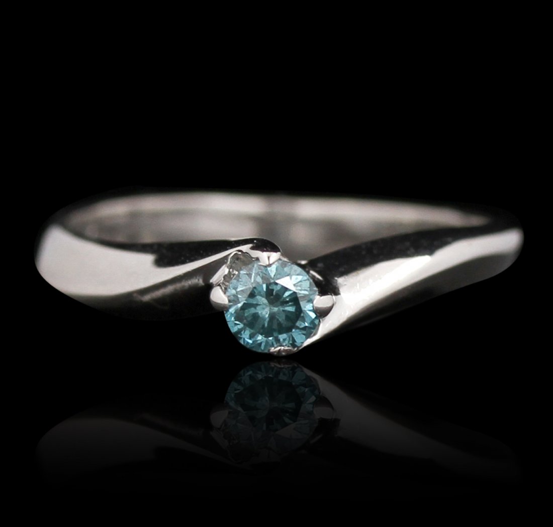 14KT White Gold 0.20ctw Blue Diamond Solitaire Ring: 14KT White Gold 0.20ctw Blue Diamond Solitaire Ring GB2317. Good Condition! DZ103KV. One ring featuring: 2.3 grams of 14KT white gold, (1) blue and round cut diamonds with a total weight of 0.20ctw.
