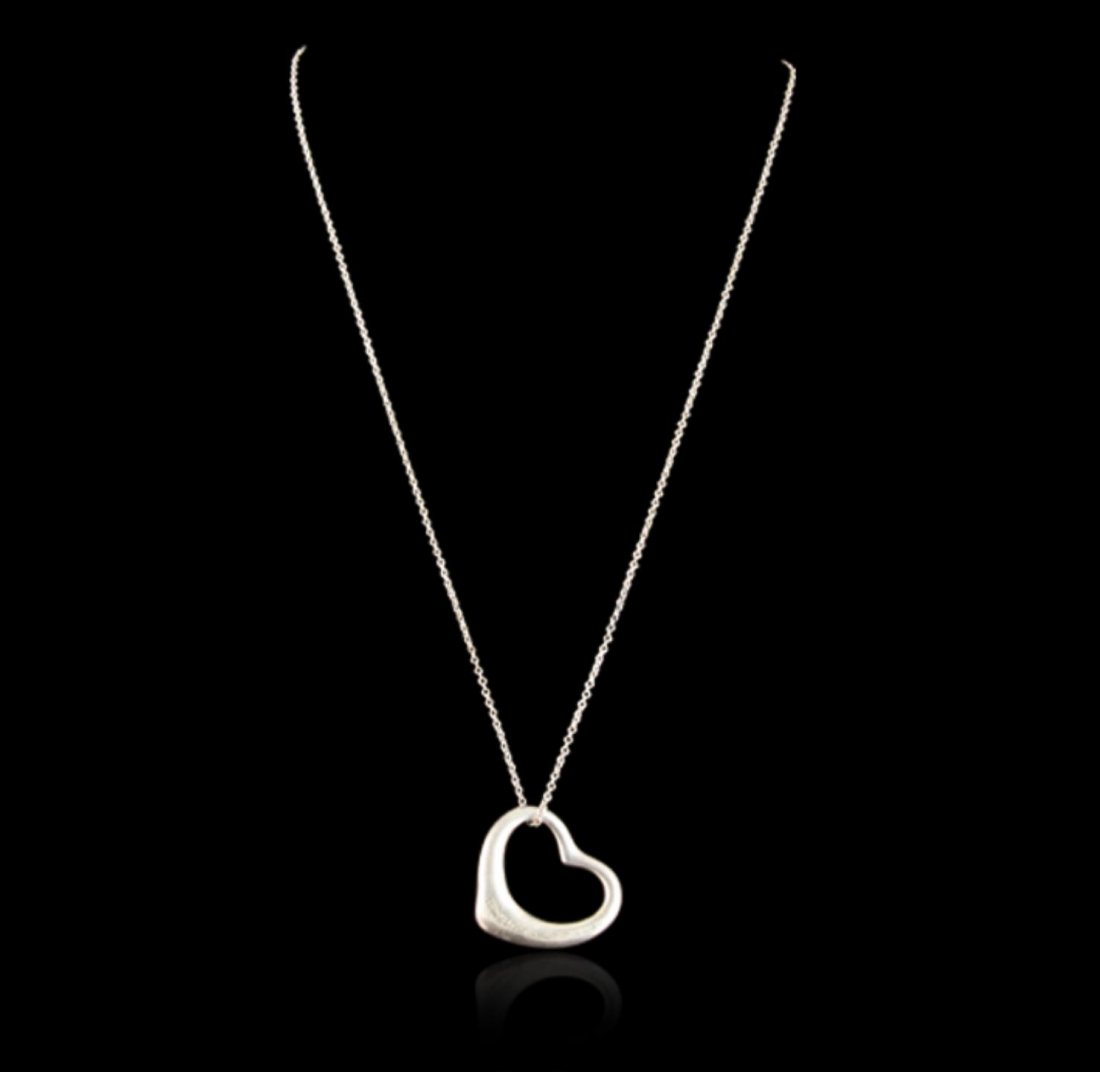 Tiffany & Co. Sterling Silver Elsa Peretti Open Heart: Tiffany & Co. Sterling Silver Elsa Peretti Open Heart Pendant JRM15. Good Condition. BX25KP. One authentic Tiffany & Co. Elsa Peretti sterling silver open heart pendant featuring: 9.8 grams of sterlin