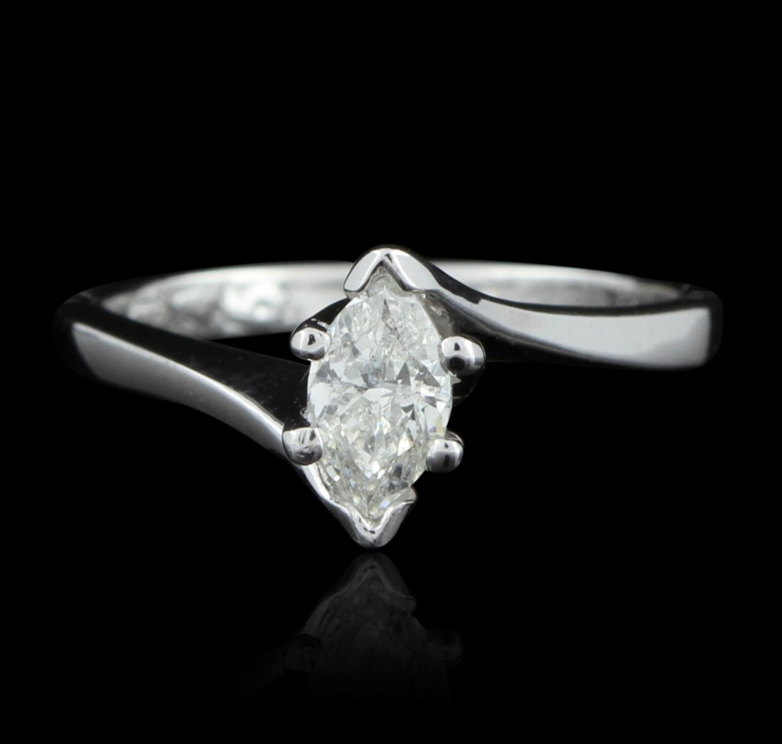 14KT White Gold 0.58ctw Marquis Diamond Solitaire Ring: 14KT White Gold 0.58ctw Marquis Diamond Solitaire Ring GB2345. Good Condition! SX107VU. One ring featuring: 3.7 grams of 14KT white gold and marquis round cut diamonds with a total weight of 0.58ctw.