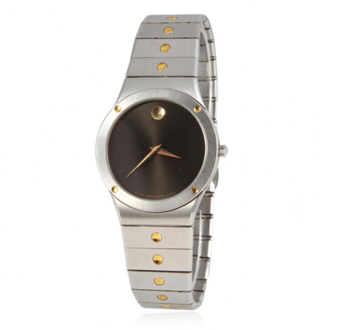 Gents Movado Two Tone Wristwatch GB2024: Gents Movado Two Tone Wristwatch GB2024. Good Condition! EG103BH. One Gents Movado Sports two tone stainless steel watch featuring: brushed stainless steel case, a black dial, gold tone 12 o'clock mar
