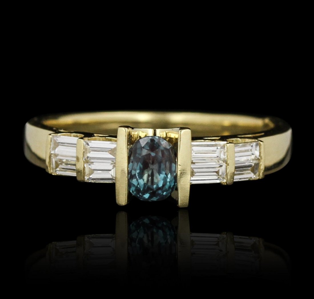 18KT Yelow Gold 0.50ct Alexandrite & Diamond Ring: 18KT Yelow Gold 0.50ct Alexandrite & Diamond Ring GB2489. Good Condition. FF219LL. One ring featuring: 4.2 grams of 18kt yellow gold, (1) alexandrite with a total weight of 0.50cts and diamonds with a