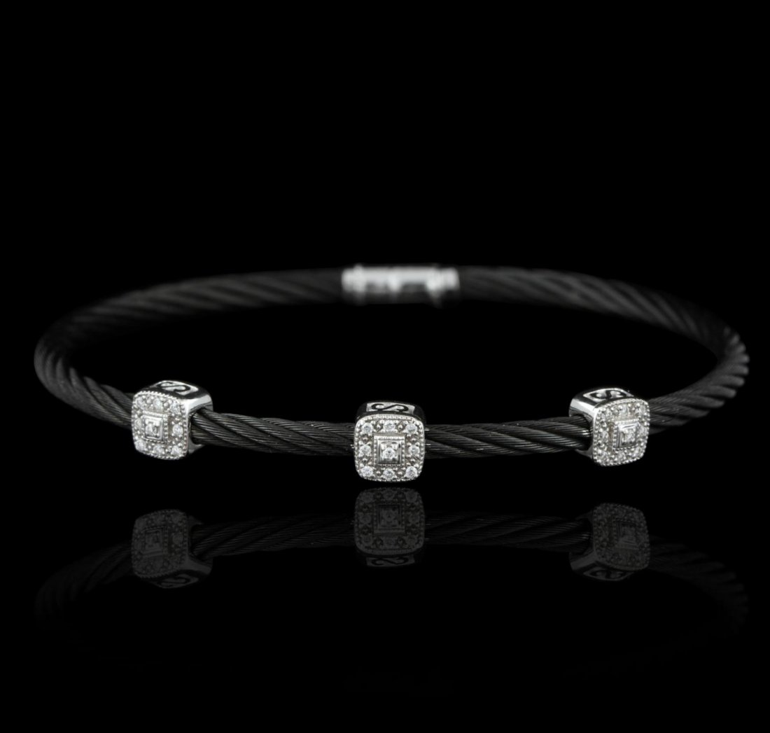 18KT White Gold Charriol 0.25ctw Diamond Black S/S Rope: 18KT White Gold Charriol 0.25ctw Diamond Black S/S Rope Bracelet GB2595. Good Condition. GR155DT. One charriol bangle bracelet featuring 9.7 grams of 18KT white gold, black and stainless steel rope, a