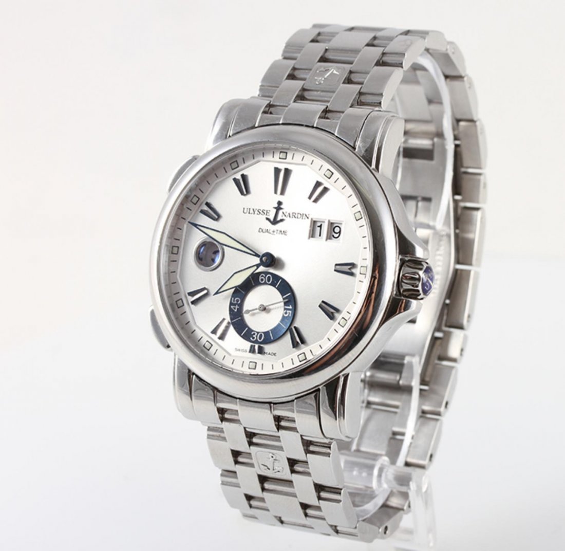 Ulysse Nardin GMT Dual Time 42mm Wristwatch BD368: Stainless Steel Ulysse Nardin GMT Dual Time 42mm Wristwatch BD368. Good Condition. RP1054PT. This watch features a 42mm Stainless Steel Case, large date wheel, silver dial, self-winding UN-24 movement
