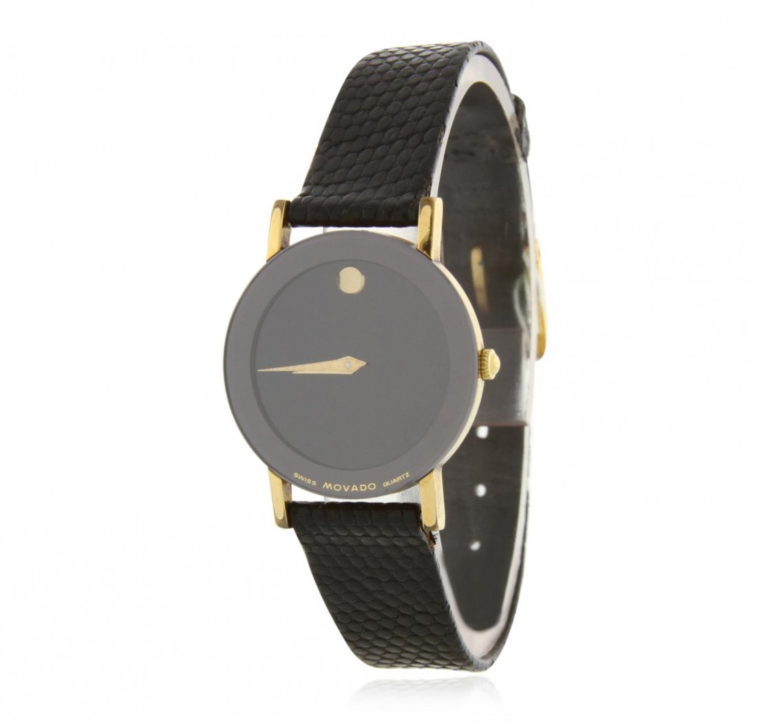 Movado Black Dial Wristwatch GB3434: Movado Black Dial Wristwatch GB3434. Average Condition. FH102VT. One movado wristwatch with a black dial and a black leather band. Comes with box.