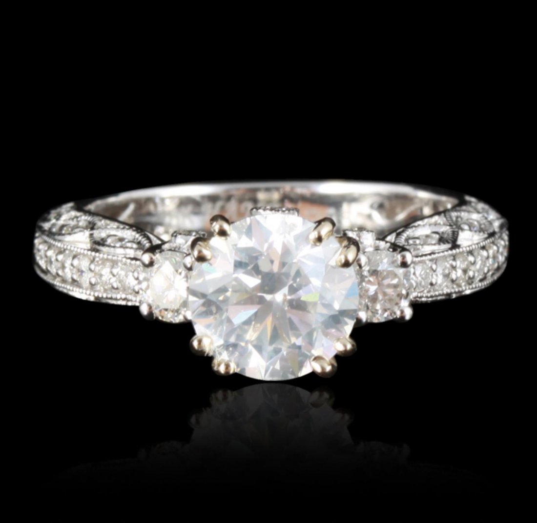 18KT White Gold 1.57ct SI-3/G Diamond Ring RM1175: 18KT White Gold 1.57ct SI-3/G Diamond Ring RM1175. New Condition! PN1006EF. One electronically tested 18KT white gold ladies cast diamond unity ring. Condition is new, good workmanship. The featured d