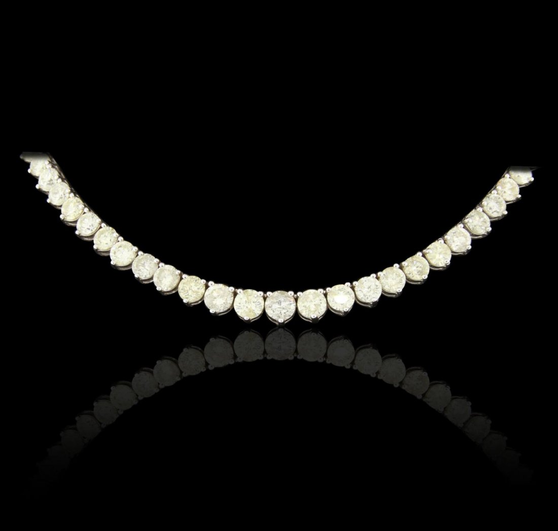 18KT White Gold 39.88ctw Diamond Necklace DJ83: 18KT White Gold 39.88ctw Diamond Necklace DJ83. Good Condition! YX80073HB. One 18KT white gold tennis necklace (3 prong setting style) weighing 40.86 grams featuring: (82) round brilliant cut natural