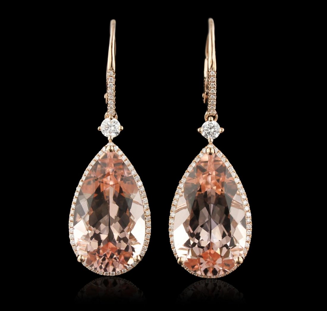 14KT Rose Gold 16.14ctw Morganite and Diamond Dangle: 14KT Rose Gold 16.14ctw Morganite and Diamond Dangle Earrings CRJ136. Good Condition! VU5071WT. One pair of dangle earrings featuring: 4.18 grams of 14KT rose gold, (1) 16.14ct morganite and 0.22cts o