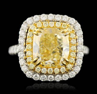 18KT Two-Tone Gold 5.01ct VS-1/Light Yellow Diamond: 18KT Two-Tone Gold 5.01ct VS-1/Light Yellow Diamond Ring A4923. Great Condition! VV12063RD. One electronically tested 18KT two-tone, yellow & white gold ladies cast & assembled diamond ring with a bri