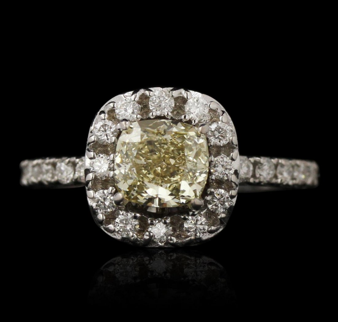 14KT White Gold 1.22ct Fancy Yellow Diamond Ring DJ95: 14KT White Gold 1.22ct Fancy Yellow Diamond Ring DJ95. Good Condition! WJ2053FP. One 14KT white gold ring weighing 3.61 grams, featuring one center cushion cut natural fancy yellow diamond weighing 1.