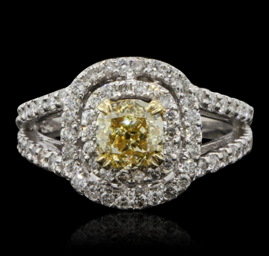 14KT White Gold 1.09ct VS-2/Fancy Yellow Diamond Ring: 14KT White Gold 1.09ct VS-2/Fancy Yellow Diamond Ring A7687. Great Condition! FY4103MV. One electronically tested 14KT yellow and white gold lady's combination cast & assembled engagement ring with a 