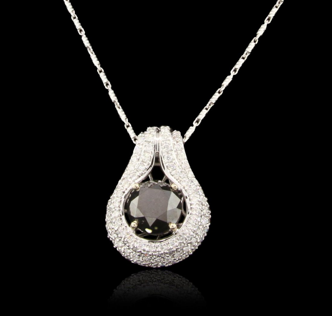 14KT White Gold 8.56ctw Black Diamond Pendant With: 14KT White Gold 8.56ctw Black Diamond Pendant With Chain RM1828. Great Condition! ZG7573MY. One electronically tested 14KT white gold ladies cast & assembled black and white diamond pendant with chain