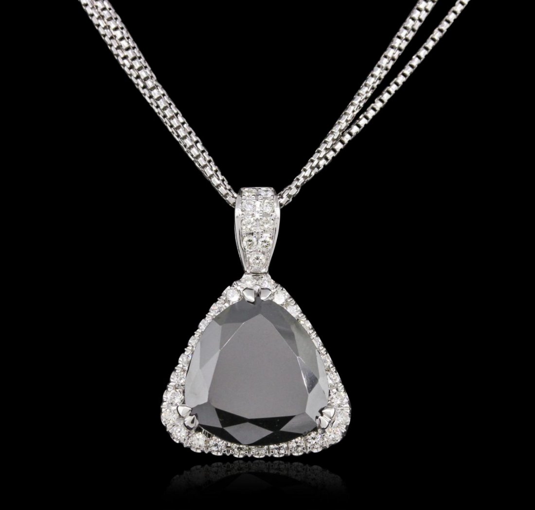 14KT White Gold 6.69ctw Black Diamond Pendant With: 14KT White Gold 6.69ctw Black Diamond Pendant With Chain GB5846. Great Condition! FR3052SW. One electronically tested 14KT white gold ladies cast & assembled black and white diamond pendant with chain