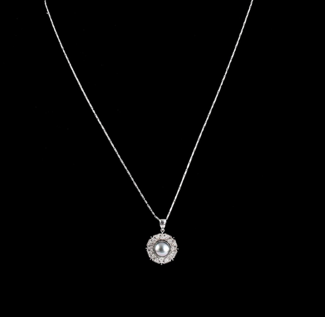 14KT White Gold Pearl & Diamond Pendant with Chain: 14KT White Gold Pearl & Diamond Pendant with Chain A5287. Good Condition! VX708VP. One electronically tested 14KT white gold ladies cast & assembled tahitian cultured pearl and diamond pendant with ch