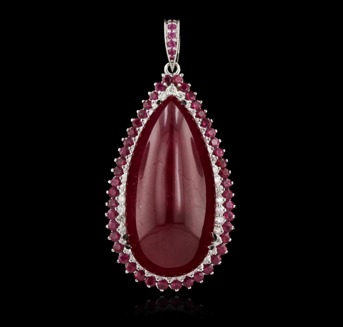 14KT White Gold 89.22ct Ruby and Diamond Pendant DJ30: 14KT White Gold 89.22ct Ruby and Diamond Pendant DJ30. Good Condition. HH1006XF. One 14KT white gold pendant weighing 11.52 grams including: One center pear shape cabochon ruby with a total weight of