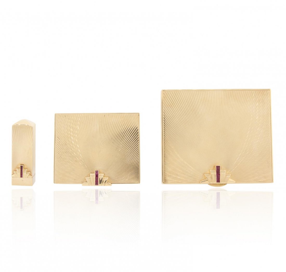 Tiffany & Co. 14KT Yellow Gold Retro Compact Set A5818: Tiffany & Co. 14KT Yellow Gold Retro Compact Set A5818. Good Condition. XR30001NB. One electronically tested 14KT yellow gold ladies cast and assembled ruby accented compact set with a bright polish f
