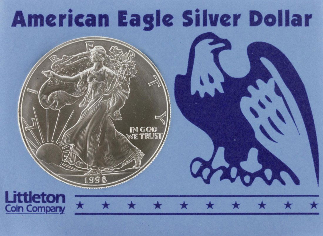 1998 Walking Liberty American Eagle Silver Dollar: 1998 Walking Liberty American Eagle Silver Dollar SCE1499. As-Is Condition! BP85PE. One silver dollar featuring: 1 oz. of fine silver. From Littleton Coin Company.