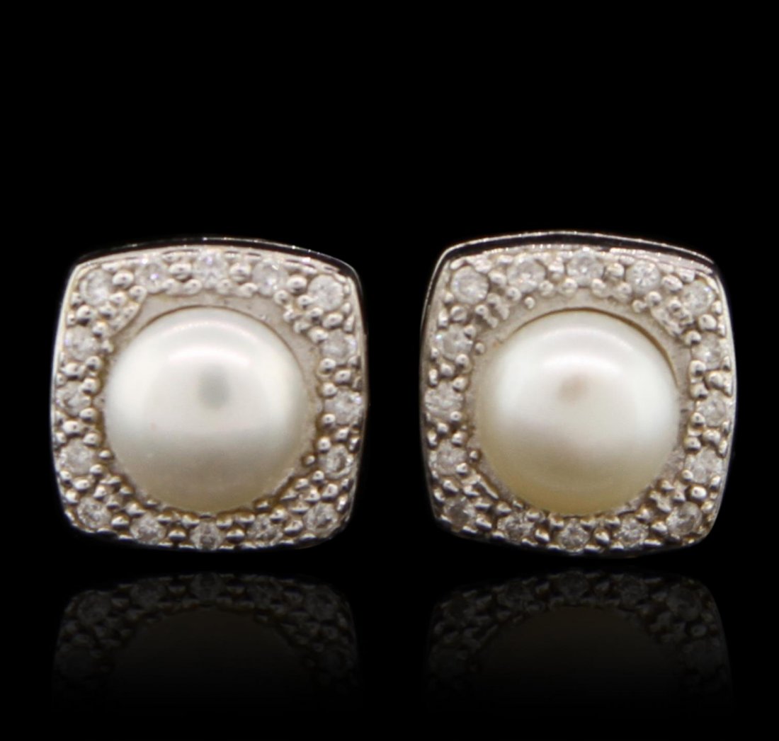 Charriol 18KT White Gold Pearl and Diamond Earrings: Charriol 18KT White Gold Pearl and Diamond Earrings GB4179. Good Condition! BJ505CP. One pair of earrings featuring: 46.80 grams of 18KT white gold, (1) pearl and 0.16cts of diamonds.