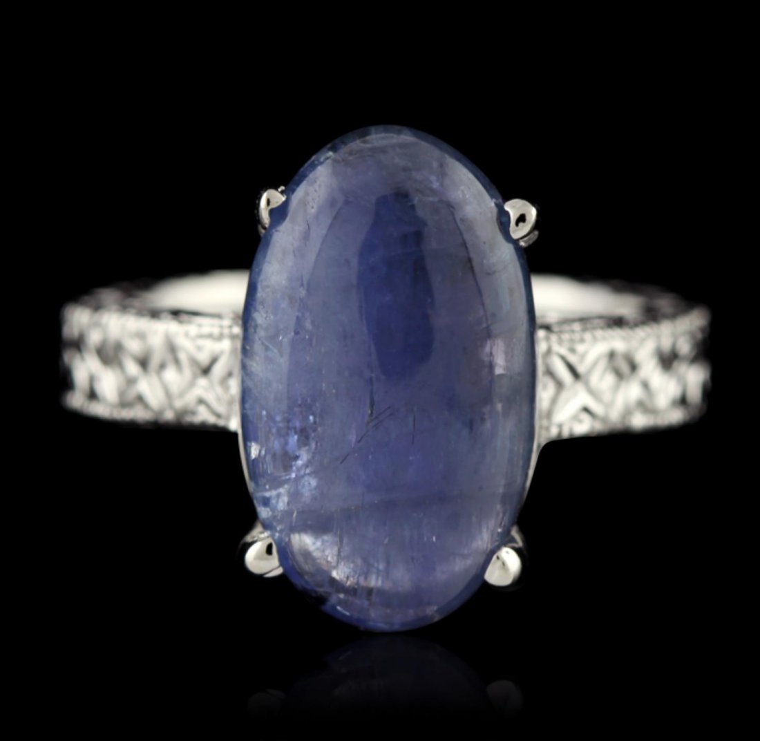 SILVER 7.94ct Tanzanite Ring SLV468: SILVER 7.94ct Tanzanite Ring SLV468. New Condition! PW821PC. One electronically tested 925 ladies cast tanzanite solitaire ring with a bright and migraine finish. The featured tanzanite is supported b