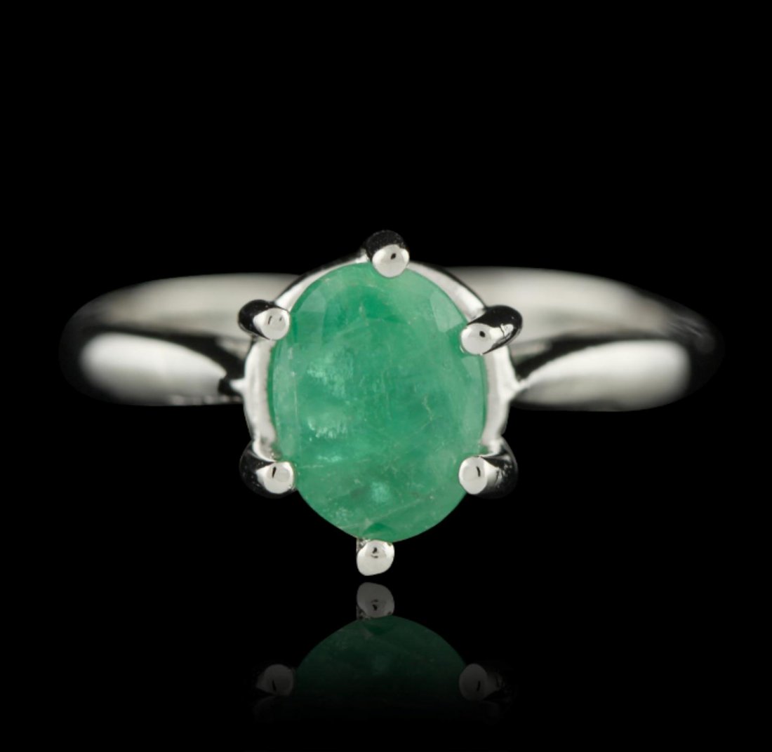 SILVER 1.08ct Emerald Ring SLV387: SILVER 1.08ct Emerald Ring SLV387. New Condition! EE201RY. One electronically tested 925 silver ladies cast emerald solitaire ring with a bright polish finish. The ring is completed by a two and one-h
