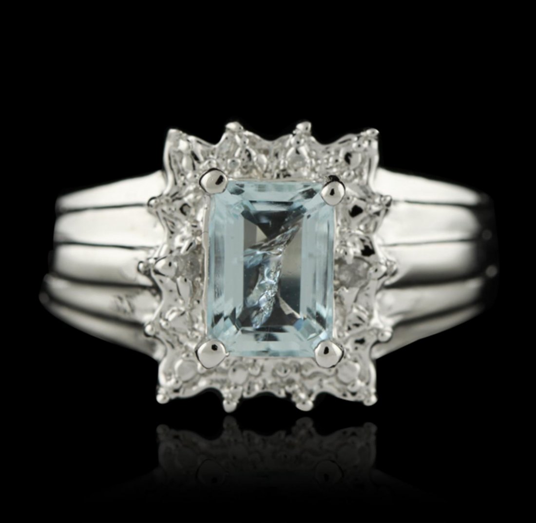 SILVER 1.12ct Aquamarine and Diamond Ring SLV345: SILVER 1.12ct Aquamarine and Diamond Ring SLV345. New Condition! NW401HH. One electronically tested 925 silver ladies cast aquamarine and diamond ring with a bright polish finish. The featured aquamar