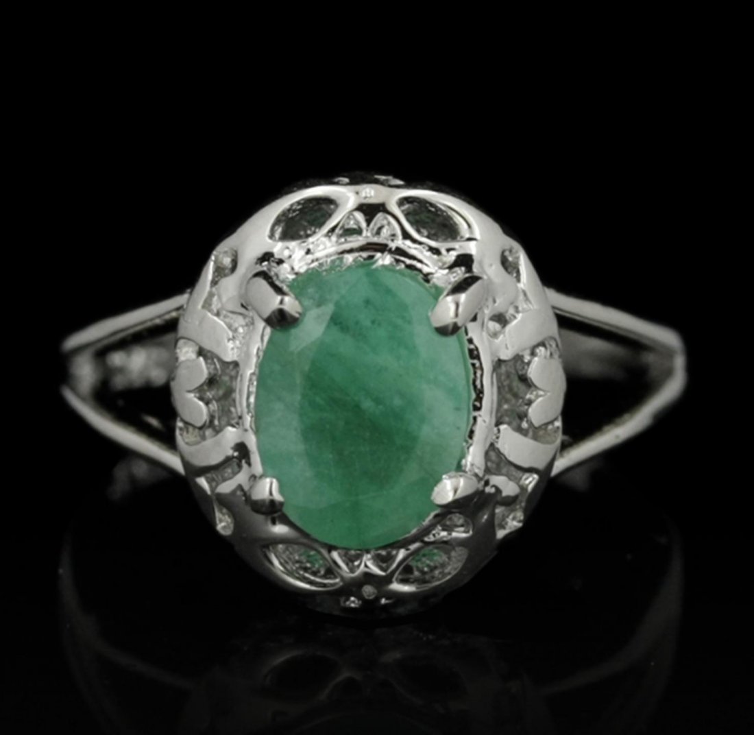 SILVER 1.12ct Emerald Ring SLV438: SILVER 1.12ct Emerald Ring SLV438. New Condition! EH501GG. One electronically tested 925 silver ladies cast emerald solitaire ring with a bright polish finish. The featured emerald is supported by spl